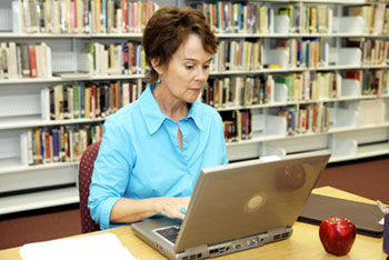 A librarian on a computer